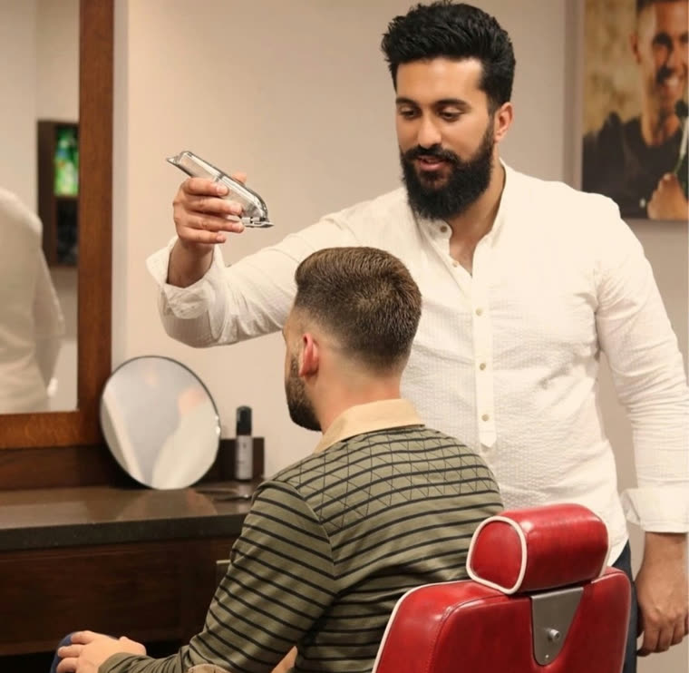Ham cutting hair at Hams Of Richmond