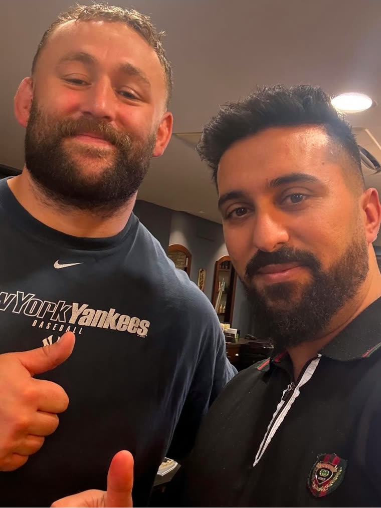 Happy client with his barber at Hams Of Richmond
