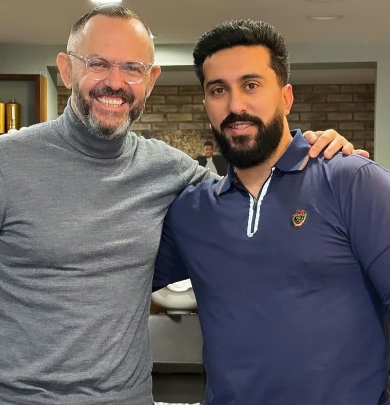 Client and barber after a fresh cut